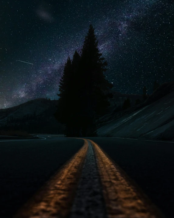 a long road with a star filled sky in the background, an album cover, pexels contest winner, 🌲🌌, multiple stories, dark, nights