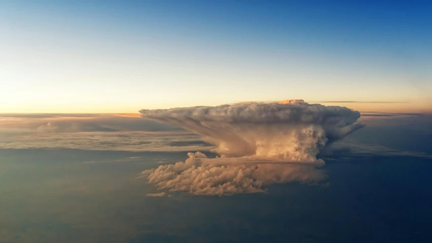 a large cloud in the sky over a body of water, by Jan Rustem, unsplash contest winner, seen from a plane, mushroom cloud, evening storm, photograph taken in 2 0 2 0
