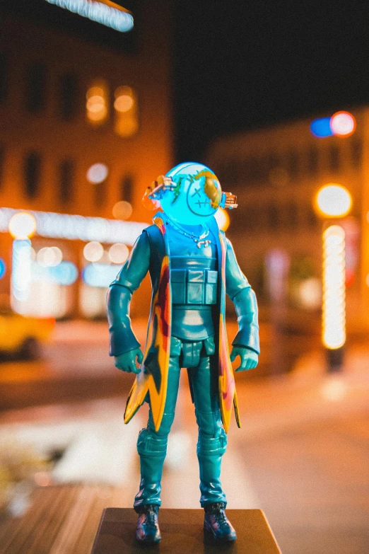 a close up of a toy on a table, a hologram, by Ryan Pancoast, unsplash, hero pose colorful city lighting, standing in township street, thunder man, teal electricity