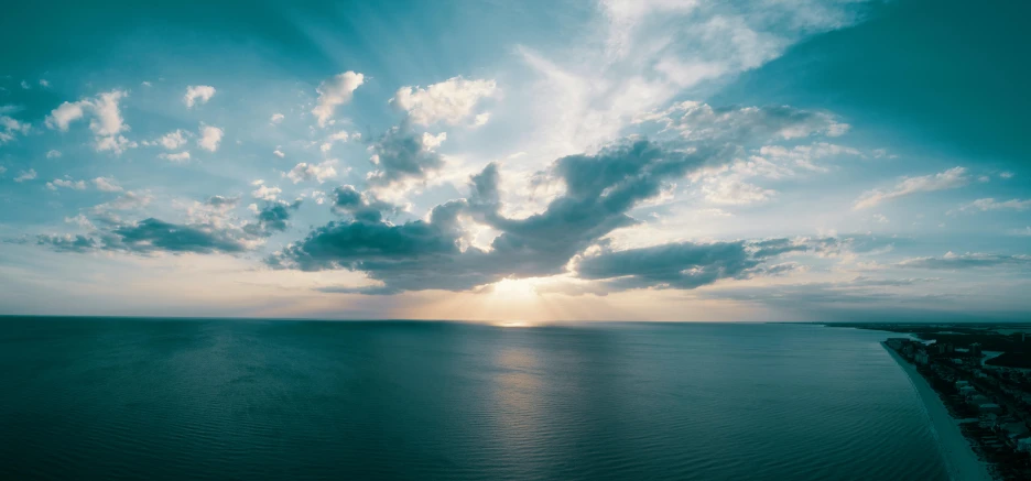 a large body of water under a cloudy sky, overhead sun, turquoise horizon, instagram post, desktop wallpaper