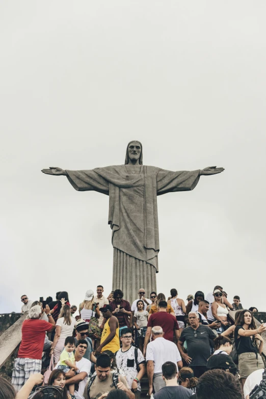 a crowd of people standing around a statue, trending on unsplash, christ the redeemer, avatar image, catholic, olympics