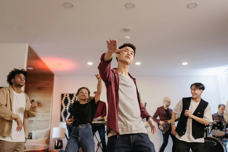 a group of people playing a video game, an album cover, trending on pexels, happening, line dancing at a party, asian male, background image, at home