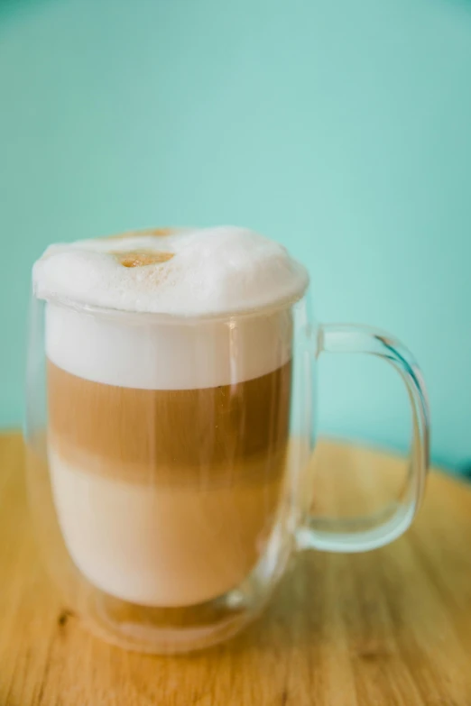 a close up of a cup of coffee on a table, frosted glass, thumbnail