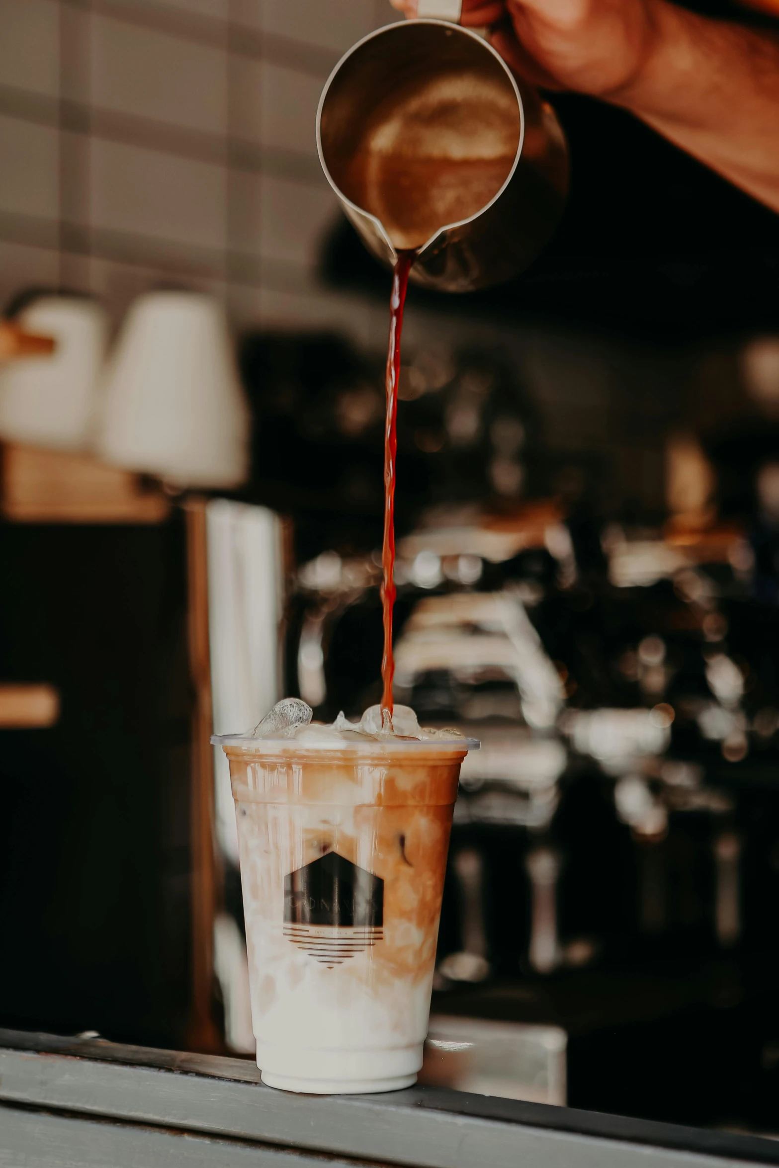 a person pouring coffee into a cup, by Robbie Trevino, trending on unsplash, ice coffee, flawless structure, instagram story, made of liquid