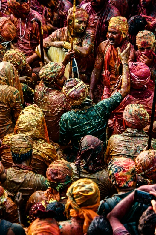 a large group of people covered in colored paint, inspired by Steve McCurry, pexels contest winner, hindu aesthetic, rusty colors, slide show, pov photo