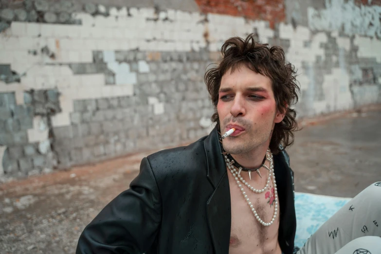 a shirtless man with a cigarette in his mouth, an album cover, by Elsa Bleda, trending on pexels, renaissance, dressed in punk clothing, big cheekbones, in an urban setting, xqc