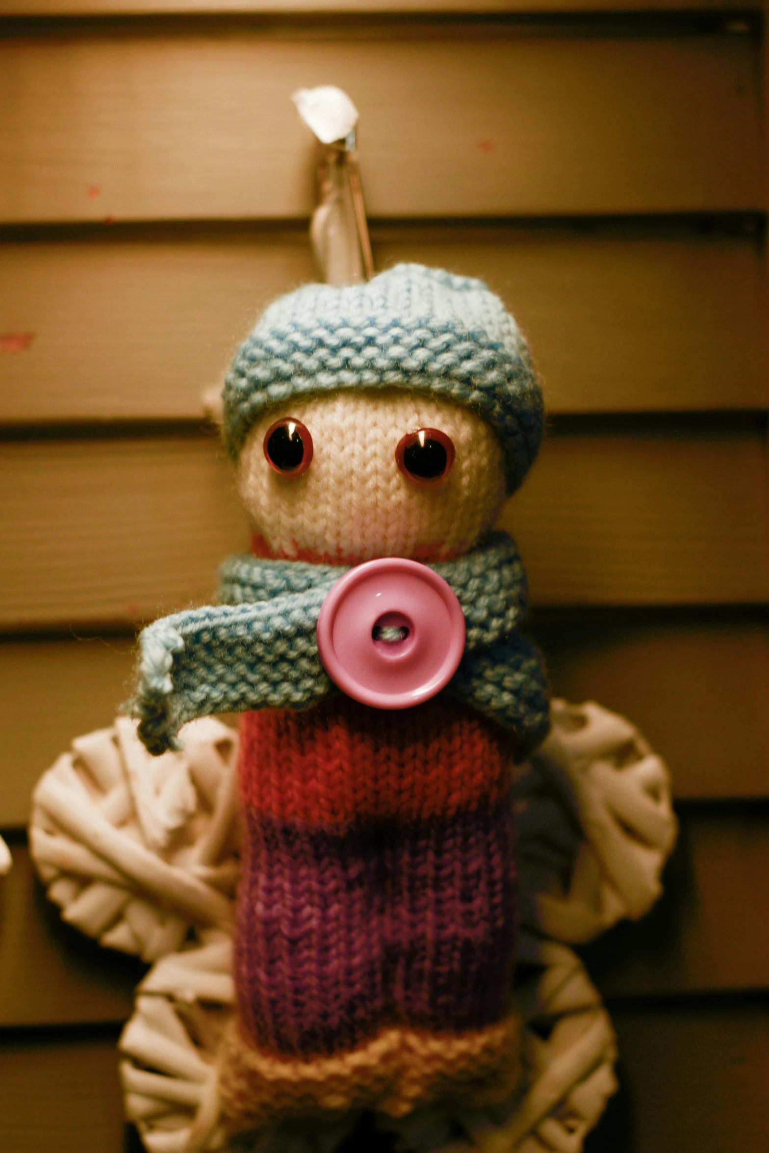 a close up of a stuffed animal wearing a sweater, by Sam Havadtoy, an angel, blue elf, taken on a 2010s camera, minn