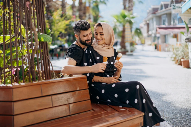 a man and a woman sitting on a bench, a picture, pexels contest winner, hurufiyya, ice cream on the side, woman holding another woman, turkey, avatar image