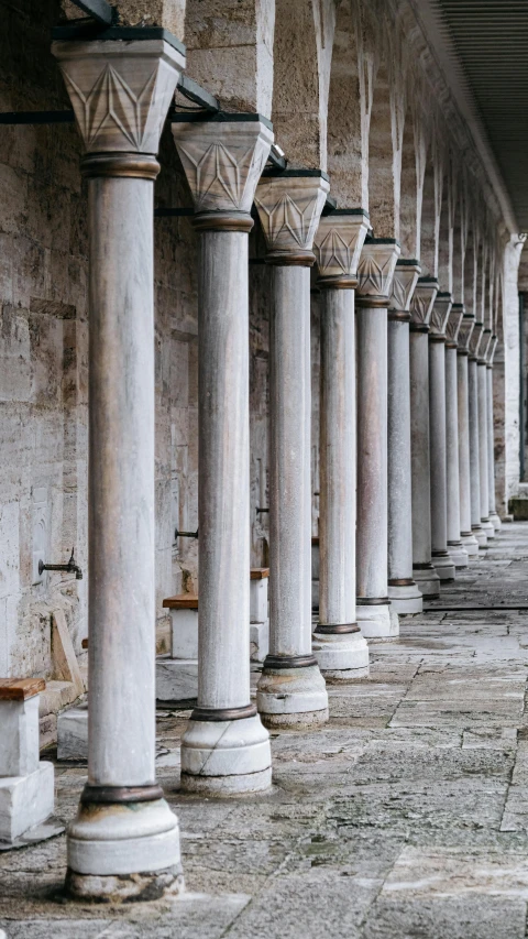 a row of columns on the side of a building, unsplash contest winner, romanesque, istanbul, deserted, high resolution photo, orthodox