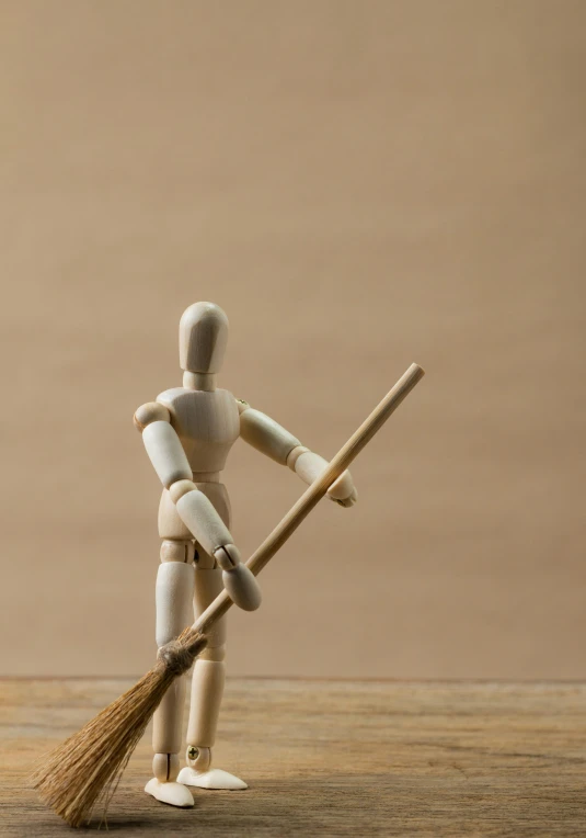 a wooden mannequin with a broom on a table, unsplash, figuration libre, 15081959 21121991 01012000 4k, t-pose of wizard, model miniature, back - shot