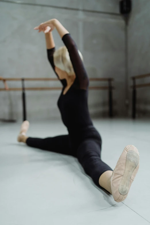 a woman in a black leo leo leo leo leo leo leo leo leo leo leo leo leo, pexels contest winner, arabesque, doing splits and stretching, square, ::