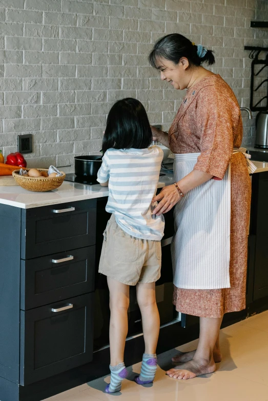 a woman standing next to a little girl in a kitchen, profile image, boys, korean, maintenance