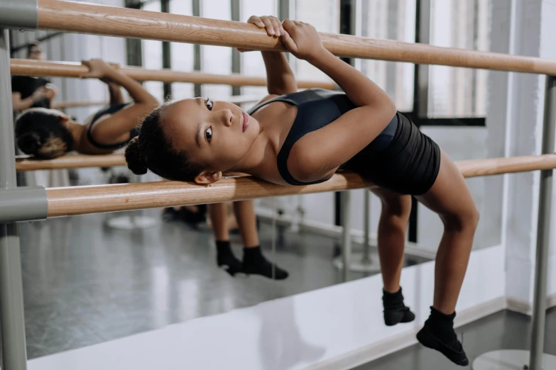 a young girl in a leoper leoper leoper leoper leoper leoper leoper leoper leoper leoper leoper leo, by Emma Andijewska, pexels contest winner, arabesque, local gym, dancers, sydney hanson, facing sideways