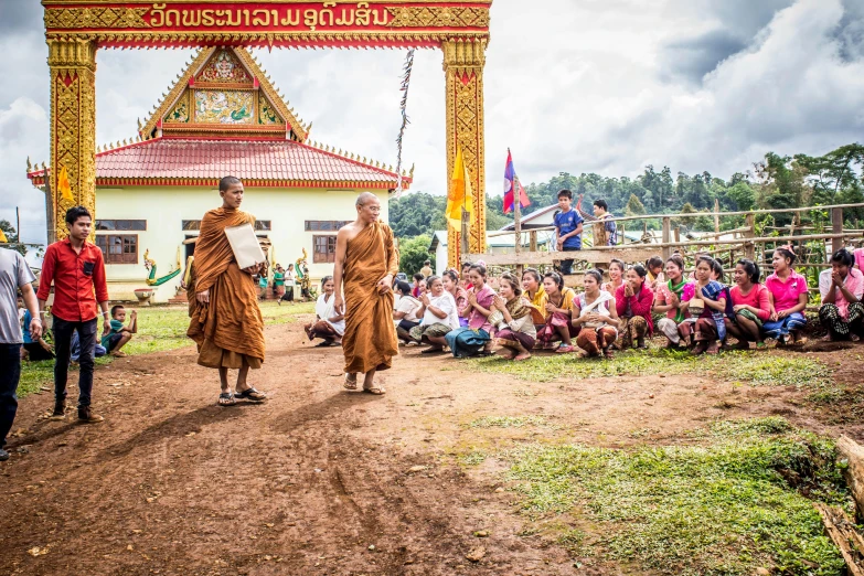 a group of people standing on top of a dirt field, thai temple, avatar image, high-resolution photo, image