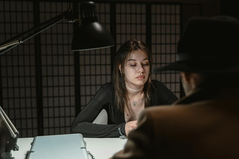 a woman sitting at a table in front of a man, inspired by Elsa Bleda, pexels contest winner, hyperrealism, female spy, kramskoi 4 k, trapped in the backrooms, promo image