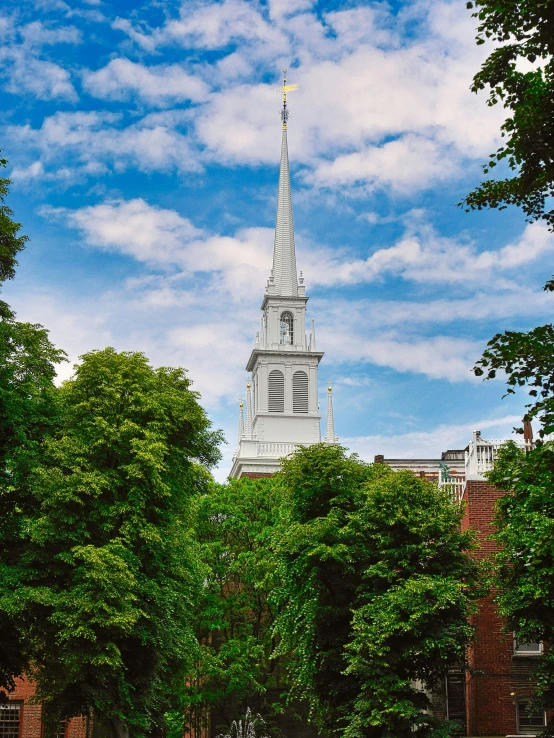 a church steeple sitting on top of a lush green field, unsplash, hudson river school, city buildings on top of trees, slide show, square, boston massachusetts