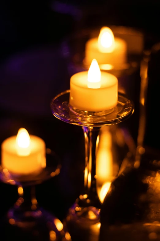 a group of lit candles sitting on top of a table, soft lighting sold at an auction, fan favorite, in 2 0 1 5, up close
