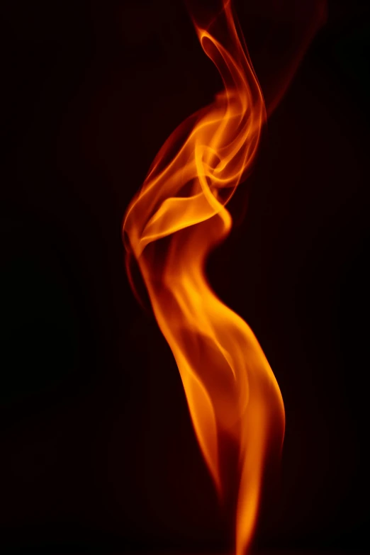 a close up of a fire on a black background, a picture, pexels, art photography, swoosh, bright flare, upright, new mexico