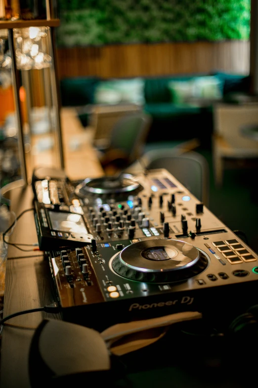 a dj controller sitting on top of a table, multiple stories, thumbnail, lounge, for junior