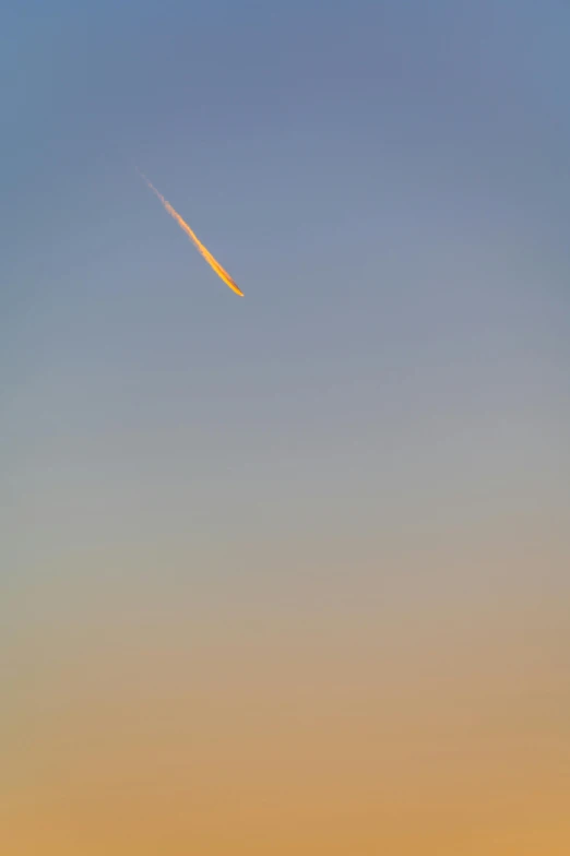 a plane that is flying in the sky, by Peter Churcher, postminimalism, meteor, golden hour photograph, 4 0 9 6, rocket