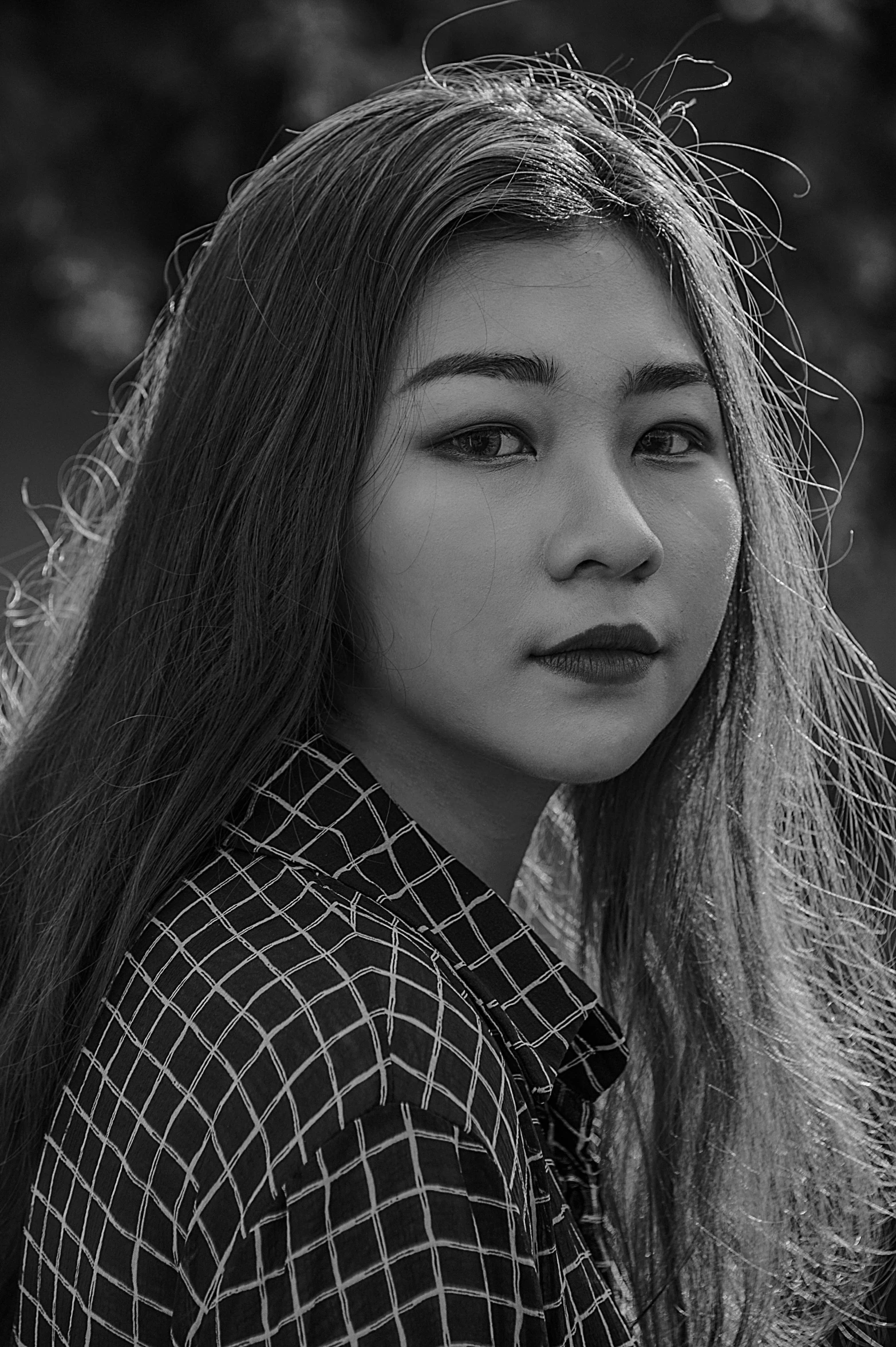 a black and white photo of a woman with long hair, a black and white photo, inspired by Jung Park, pexels contest winner, realism, young cute wan asian face, cl, south east asian with round face, afternoon