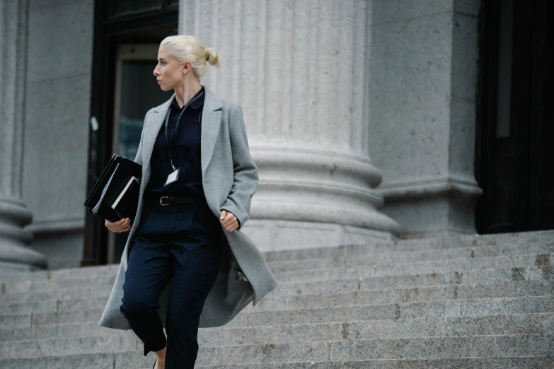 a woman walking up the steps of a building, lawyer clothing, curated collections, thumbnail, the fall season