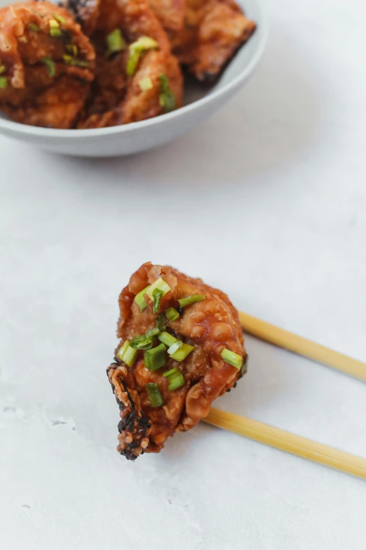 a close up of a plate of food with chopsticks, battered, profile image, thumbnail, taejune kim