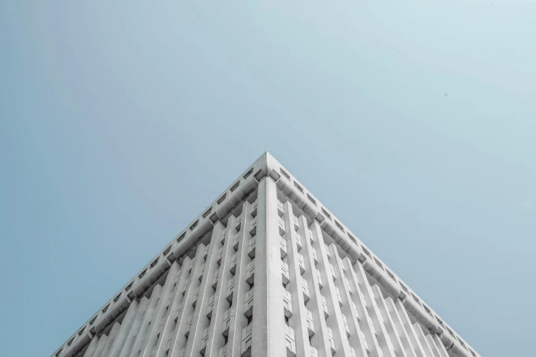 a tall building with a clock on top of it, inspired by David Chipperfield, pexels contest winner, brutalism, white concrete, square lines, 2 0 0 0's photo, up there