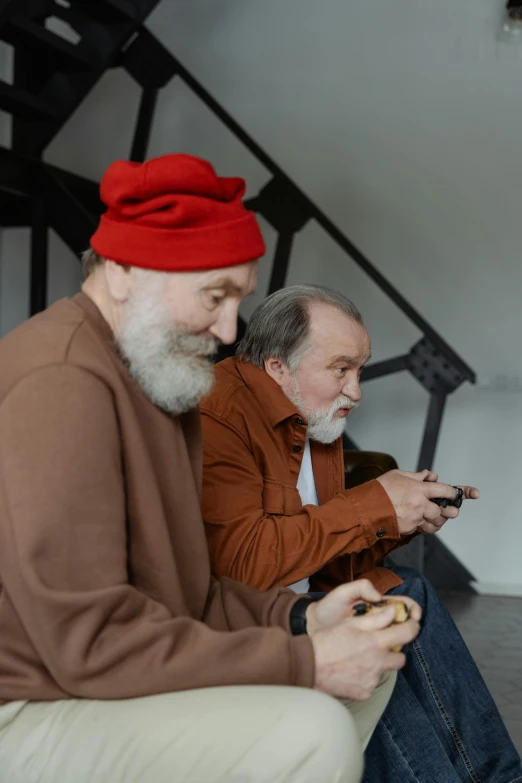 a couple of men sitting next to each other on a couch, inspired by Jean Fouquet, trending on pexels, modernism, old gigachad with grey beard, gaming, 2 5 6 x 2 5 6 pixels, red hat