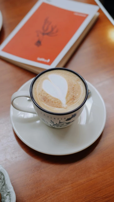 a cup of coffee sitting on top of a saucer, by Robbie Trevino, pexels contest winner, jakarta, thumbnail, multiple stories, cappuccino