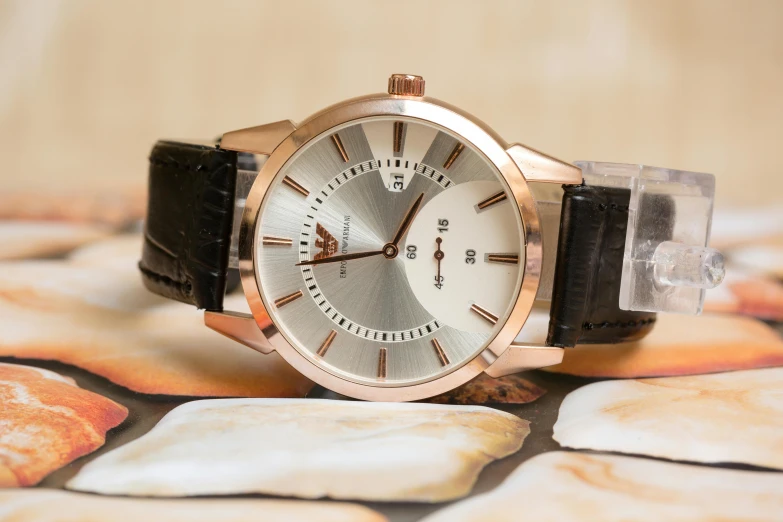 a close up of a watch on a table, inspired by Alexander Fedosav, rose gold, with sharp features, very sharp and detailed photo, thumbnail