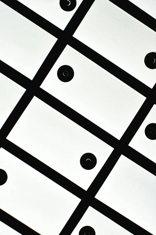 a black and white photo of a ceiling, inspired by Alexander Rodchenko, unsplash, squares, black dots, high angle close up shot, square