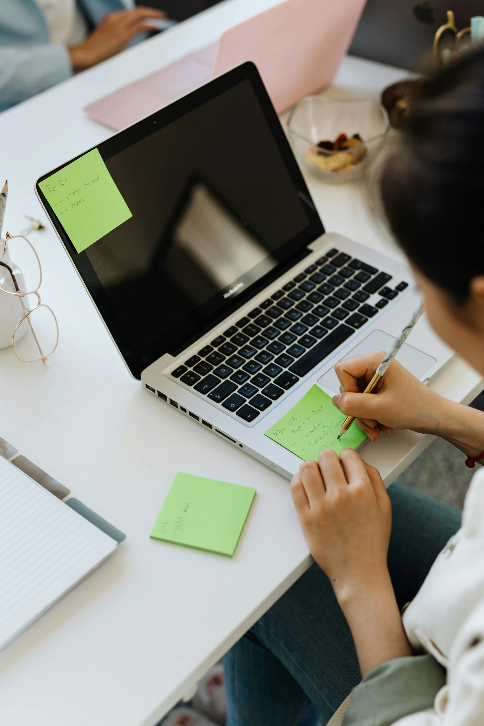 a woman sitting at a desk working on a laptop, trending on pexels, arbeitsrat für kunst, ink on post it note, lime green, square, high resolution image