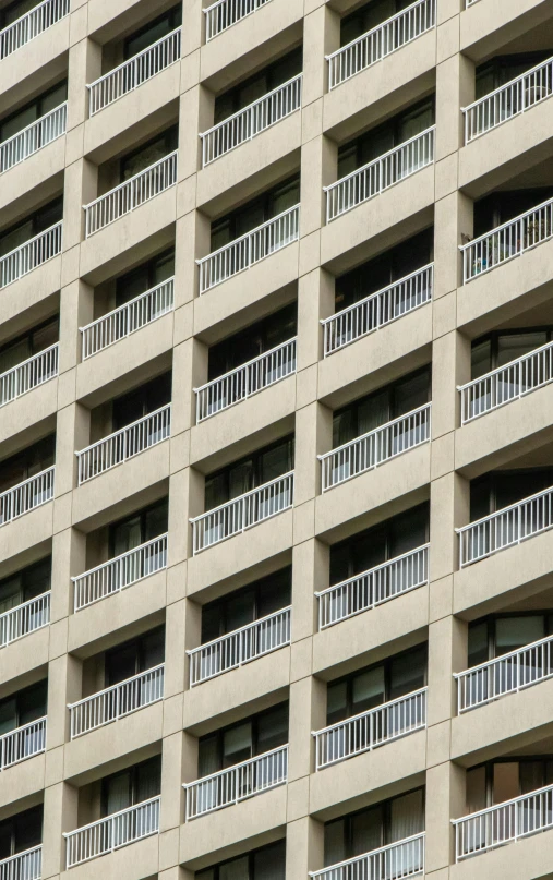 an apartment building with balconies and balconies on the balconies, hotel room, zoomed out shot, square, getty images