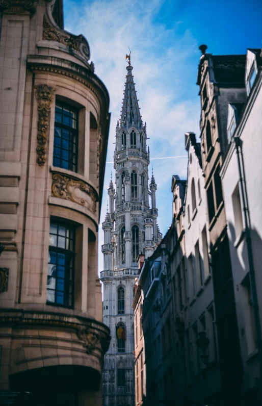 a tall clock tower towering over a city street, by Daniel Seghers, pexels contest winner, baroque, belgium, buttresses, square, high quality photo