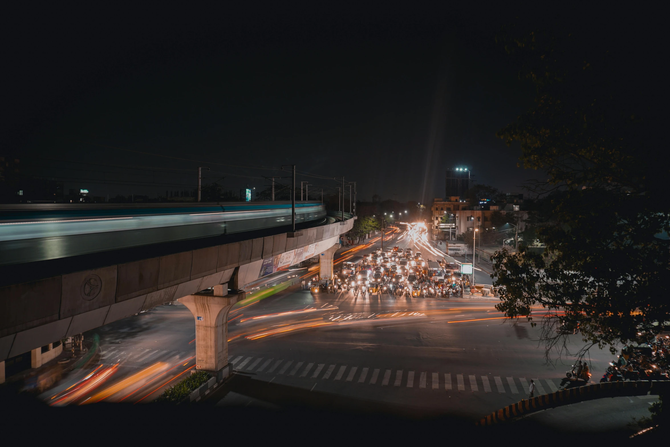 a city street filled with lots of traffic at night, an album cover, by Alejandro Obregón, pexels contest winner, indore, overpass, panoramic anamorphic, concert