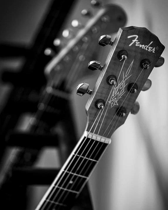 a black and white photo of a guitar, by Adam Marczyński, high quality wallpaper, webs, rack focus, [ metal ]