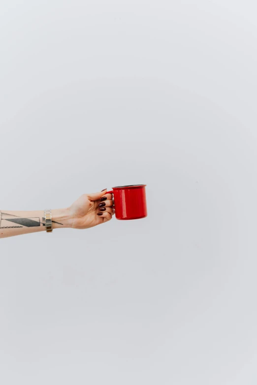 a woman with tattoos holding a red cup, by Will Ellis, trending on pexels, minimalism, rectangle, 1 2 9 7, red painted metal, small