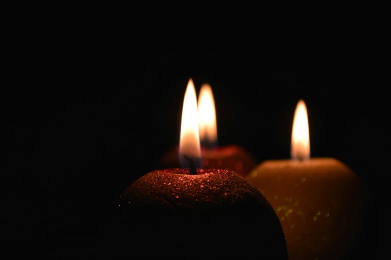 two lit candles sitting side by side in the dark, pexels, profile image, 15081959 21121991 01012000 4k, bokeh volumetric lighting, arson