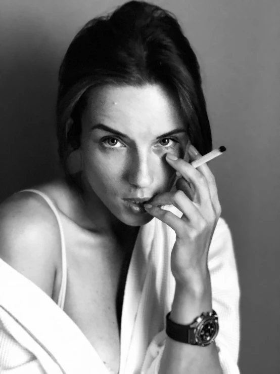 a black and white photo of a woman smoking a cigarette, by Lucia Peka, fine art, emma!! watson!!, claire forlani, maxim sukharev, dua lipa