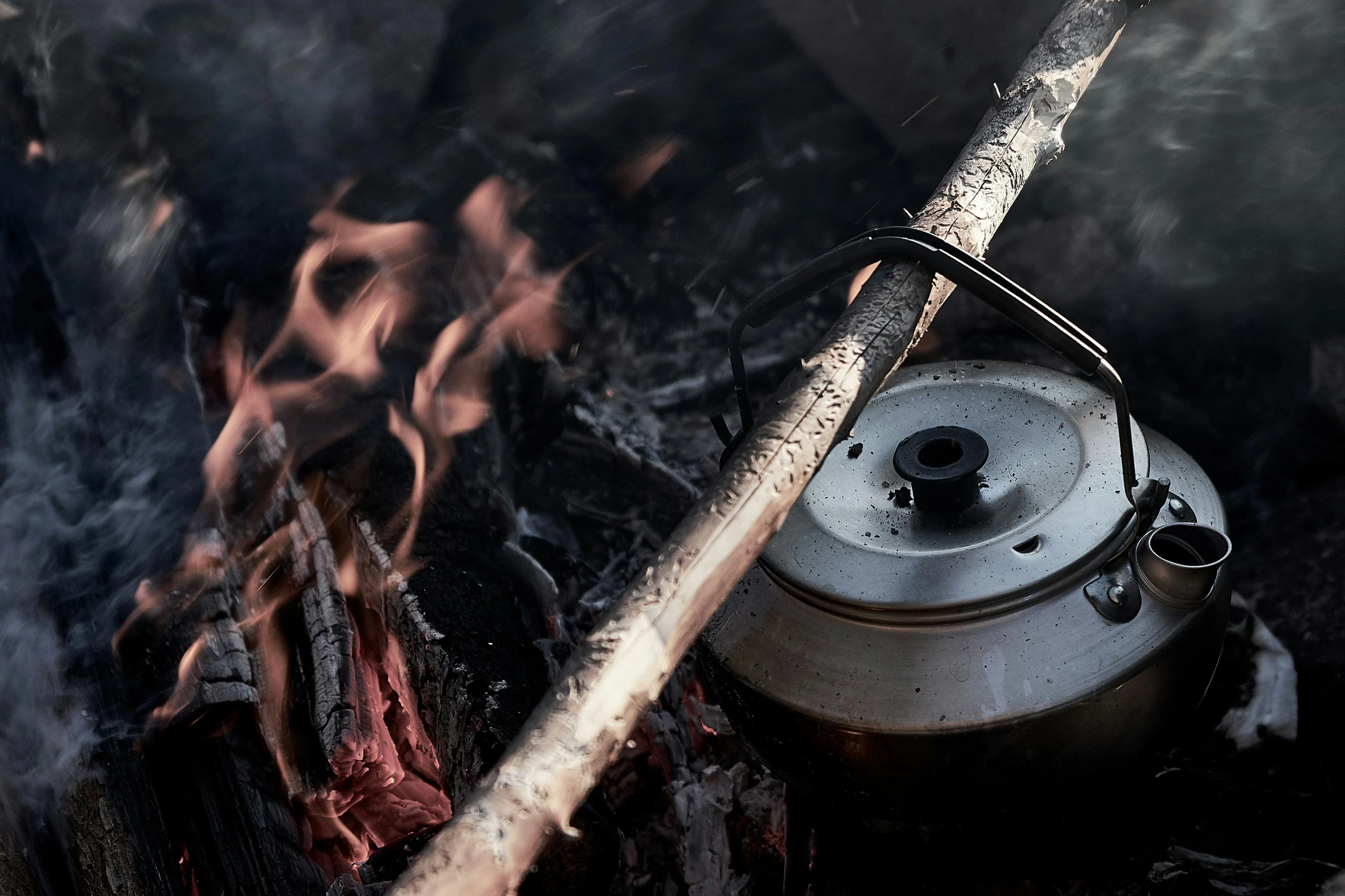 a kettle sitting on top of a fire next to a stick, pexels contest winner, hurufiyya, dynamic closeup, press shot, ready to eat, thumbnail