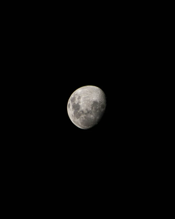 the moon is lit up in the dark sky, by Peter Churcher, hurufiyya, slightly rounded face, detailed medium format photo, smol, ✨🕌🌙