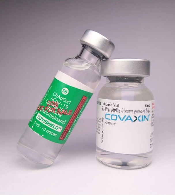 a couple of vials sitting next to each other, hyperrealism, very detailed labeling, csók istván, covid, cosmopolitan