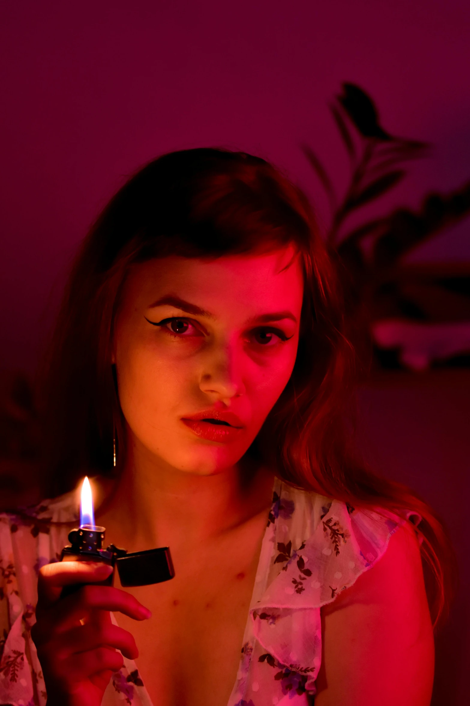 a woman holding a lit candle in her hand, an album cover, inspired by Nan Goldin, trending on pexels, magic realism, portrait sophie mudd, looking serious, high resolution movie still, purple scene lighting