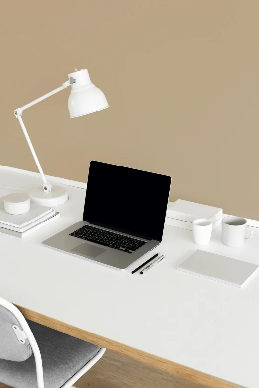 a laptop computer sitting on top of a white desk, cream and white color scheme, 9 9 designs, no people, design only