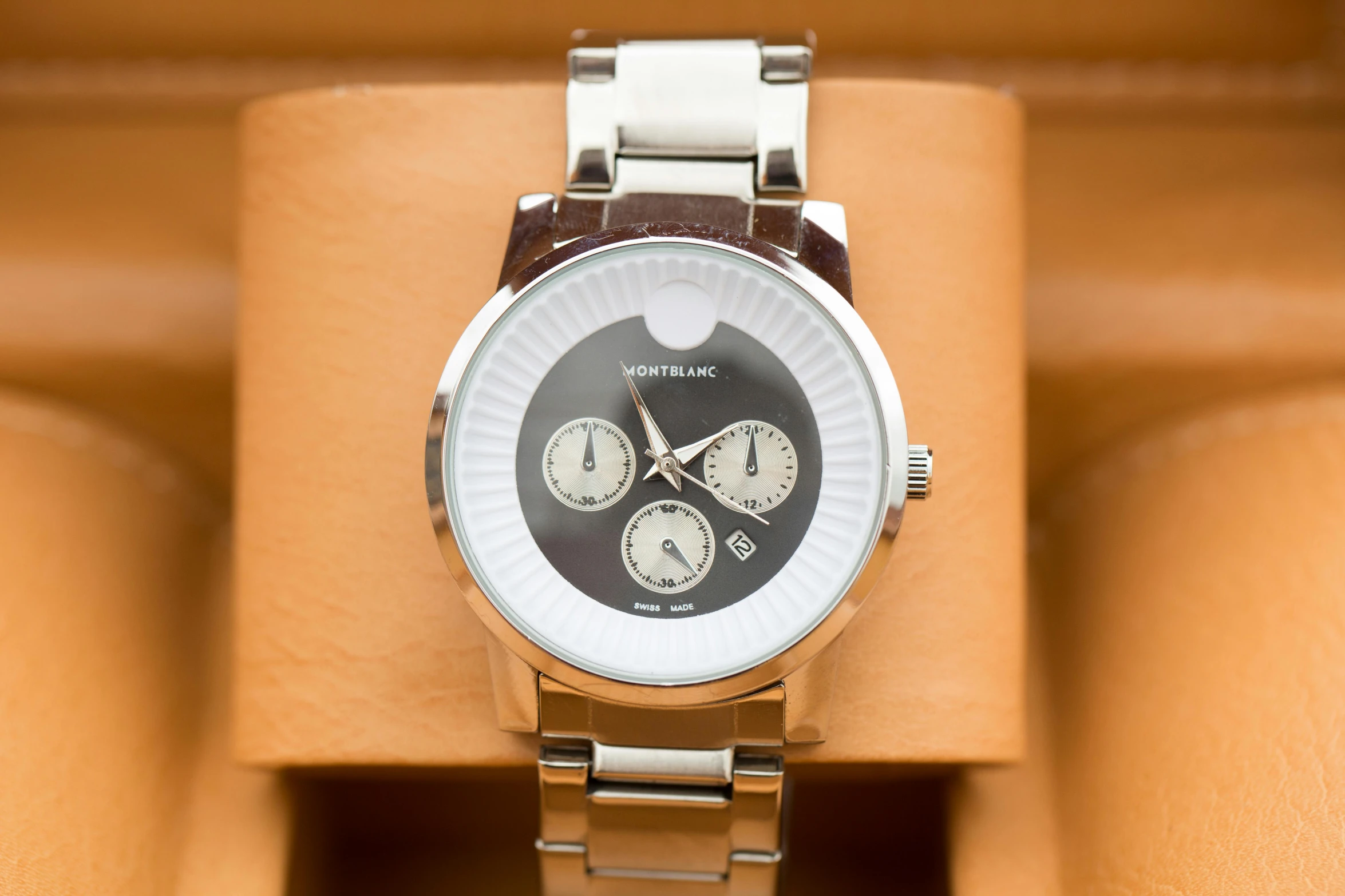 a close up of a watch in a box, unsplash, versace, gradient brown to silver, michael kors, dynamic closeup