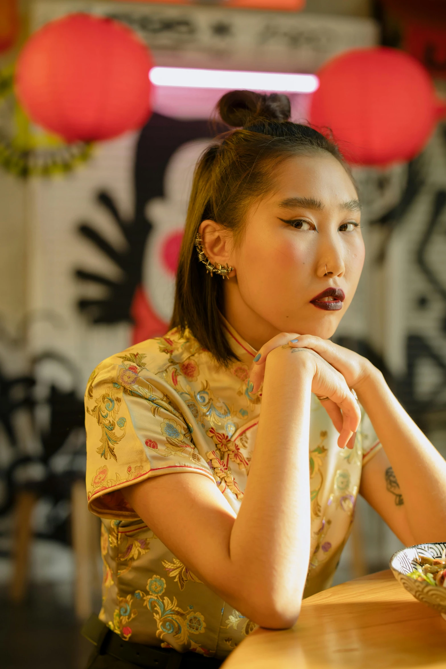 a woman sitting at a table with a bowl of food, a portrait, inspired by Xia Chang, trending on pexels, toyism, wearing a crop top, hand on her chin, at a fashion shoot, ashteroth