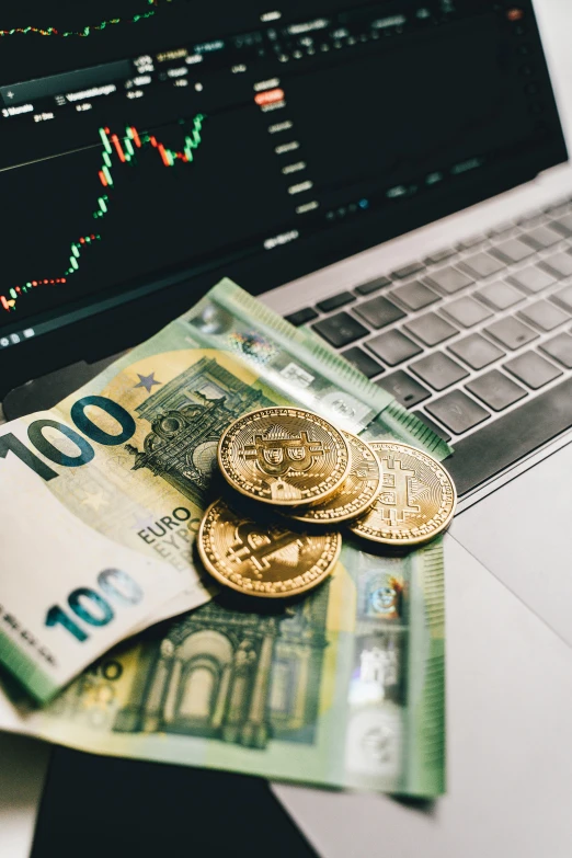 a laptop computer sitting on top of a pile of money, by Daniel Lieske, trending on unsplash, renaissance, cryptocurrency, cyan and gold scheme, 🚿🗝📝