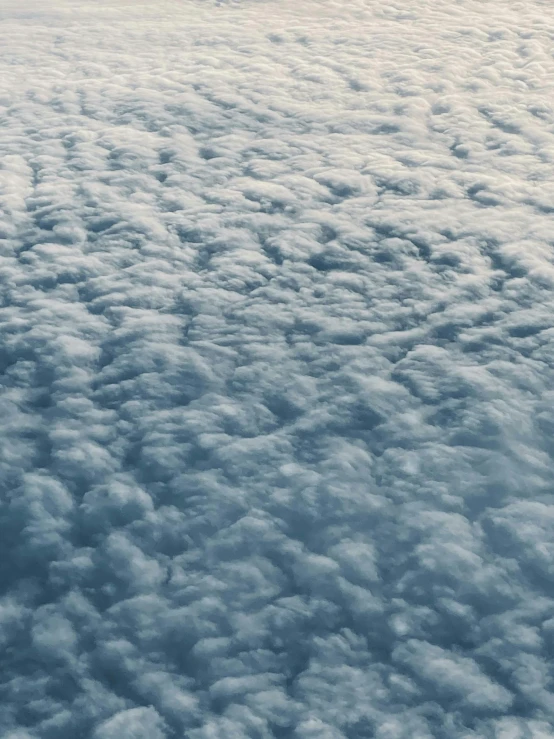 an airplane is flying high above the clouds, an album cover, by Matt Cavotta, trending on unsplash, mammatus clouds, medium closeup, blanket of fog, ilustration