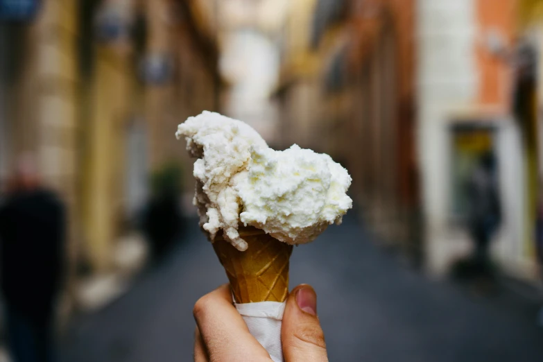 a person holding an ice cream cone in their hand, pexels contest winner, renaissance, plenty mozzarella, view from the streets, glossy white, thumbnail